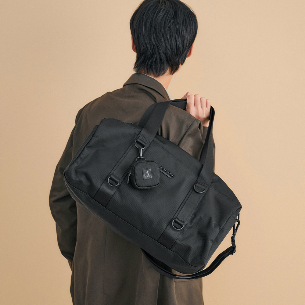 PORTER INTERNATIONAL 圓筒輪廓 ROLLIN系列 行李袋 (黑色)