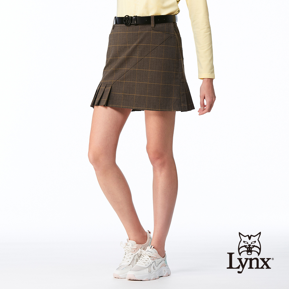 Lynx Golf 女款日本進口布料彈性舒適不對稱下擺百褶後袋剪接織帶繡花造型休閒短裙-深卡其色